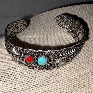 Intricate Silver Bracelet with Red and Turquoise Stones